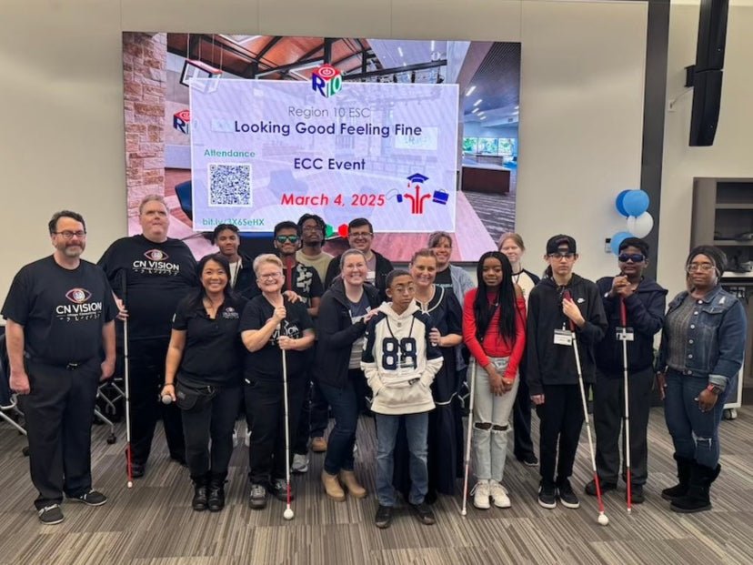 A group of students smiling with CN Vision founder Chelsea Nguyen